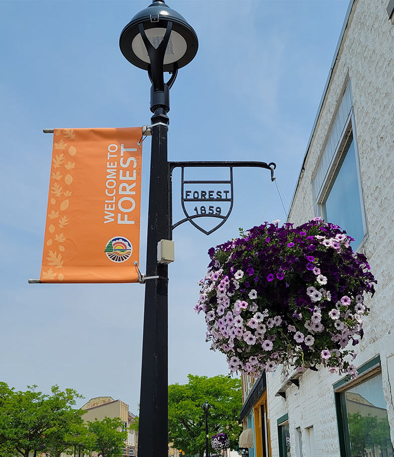 Orange banner hanging from a lightpost